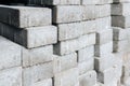 Gray silicate bricks are stacked. Industrial background.