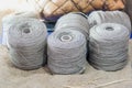 Gray silver yarn threads spools bobbin close up. sewing workshop details