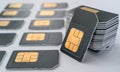 Gray SIM card for phones gathered in a pile, lie close to a number of other cards Royalty Free Stock Photo