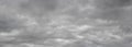 The gray sky is covered with dense clouds, sky before the storm, autumn and winter sky Royalty Free Stock Photo