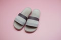 Gray slide sandal summer slippers on pink background