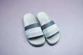 Gray slide sandal summer slippers on purple background