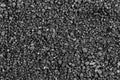 Gray small rocks ground texture. black small road stone background. gravel pebbles stone seamless texture, marble. dark background