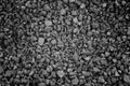 Gray small rocks ground texture. black small road stone background. gravel pebbles stone seamless texture, marble. dark background