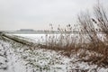 Gray snow sky above a snowy Dutch polder landscape in the winter season