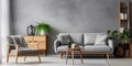 Gray sofa and armchair near wooden coffee table in cozy apartment. Interior design of modern Scandinavian living room Royalty Free Stock Photo