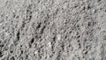 gray soil mixed with cement in close-up photo