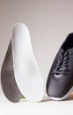 Gray sport shoes  with orthopedic insoles. Foot care products conception Royalty Free Stock Photo