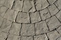 Stamped concrete pavement outdoor, mimics cobblestones circular pattern with waves, decorative appearance colors and Royalty Free Stock Photo