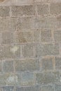 Gray stone background urban design vertical wall tower rectangular cobblestone pattern Royalty Free Stock Photo