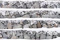 Gray stone wall in winter snow Royalty Free Stock Photo