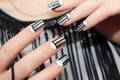 Gray striped nail design .