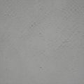 Gray stucco wall with a rough texture, characterized by small, uneven bumps and sub Royalty Free Stock Photo