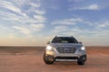 Gray Subaru in the sand of the Namib desert at a bright sky. Walvis Bay, Namibia