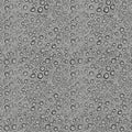 Gray surface covered in water droplets of varying sizes creating a pattern Royalty Free Stock Photo