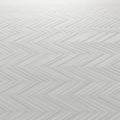 Gray surface featuring a repeating chevron pattern. The design comprises zigzag lines Royalty Free Stock Photo