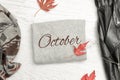 Gray sweater with inscription October, a black jacket, scarf and