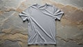 T shirt displayed on textured stone surface featuring irregular layered Royalty Free Stock Photo