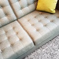 Gray textile sofa with cushion