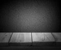 Gray textural wall with a wooden table. Empty space for text Royalty Free Stock Photo