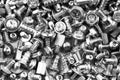 Gray texture background of many randomly scattered computer screws Royalty Free Stock Photo