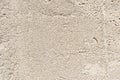 Gray texture of the porous surface of concrete wall of the building with minor damages Royalty Free Stock Photo