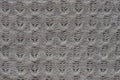 Gray texture of woolen fabric with a knitted pattern Royalty Free Stock Photo