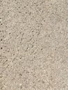 Gray textured porous wall. Abstract stone texture. Minimalistic background. Royalty Free Stock Photo