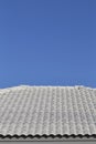 Gray tile roof against the blue sky Royalty Free Stock Photo