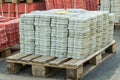 Tiles piled in pallets, warehouse paving slabs in the factory for its production