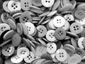 Gray tone disorderly sewing buttons background Royalty Free Stock Photo