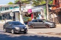 gray Toyota vios sedan on the road near the cafe