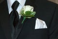 Gray tux with white rose boutonniere