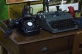 Typewriters and ancient phones On the wooden table Royalty Free Stock Photo