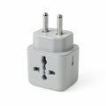Gray Universal Travel Adapter with Multiple Plug Types on White Background Royalty Free Stock Photo