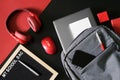 Gray urban backpack with laptop, pen, notepad and smartphone on a black and red next to headphones, mouse and the inscription my Royalty Free Stock Photo