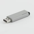 Gray USB Drive for Data Storage and Transfer on White Background in Studio Royalty Free Stock Photo