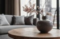 gray vase on wooden coffee table, interior of living room in minimalism style, gray shades prevail, , minimalism concept, Royalty Free Stock Photo