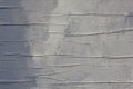 Gray wall with a cloth with pleats and white spots and splashes of paint. rough surface texture Royalty Free Stock Photo
