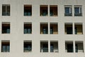 Gray wall of a large house with rows of windows Royalty Free Stock Photo