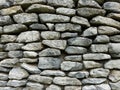 Gray wall from large stones background texture, grey stone slate wall concrete grout, rock Royalty Free Stock Photo