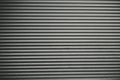 Gray wavy grooved metal texture, copy space