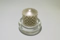 Gray wax candle in a glass base isolated Royalty Free Stock Photo