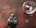 Gray whiskey rocks on wooden table