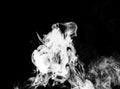 Gray, white smoke in the dark on a black background, isolated steam, fume, dry ice Royalty Free Stock Photo