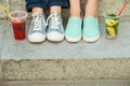 Sneakers, moccasins and cold drink