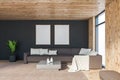 Gray and wood living room sofa and poster gallery Royalty Free Stock Photo