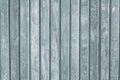 Gray wood vertical planks in rustic style. Grunge background of construction material. Wooden texture board. Pattern of grey old f