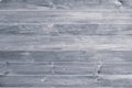 Gray wooden background. Grey wood boards, messy fence, planks. Weathered, vintage surface, pattern. Horizontal stripes on shabby p