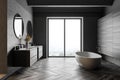 Gray and wooden bathroom interior, tub and sink. side view Royalty Free Stock Photo